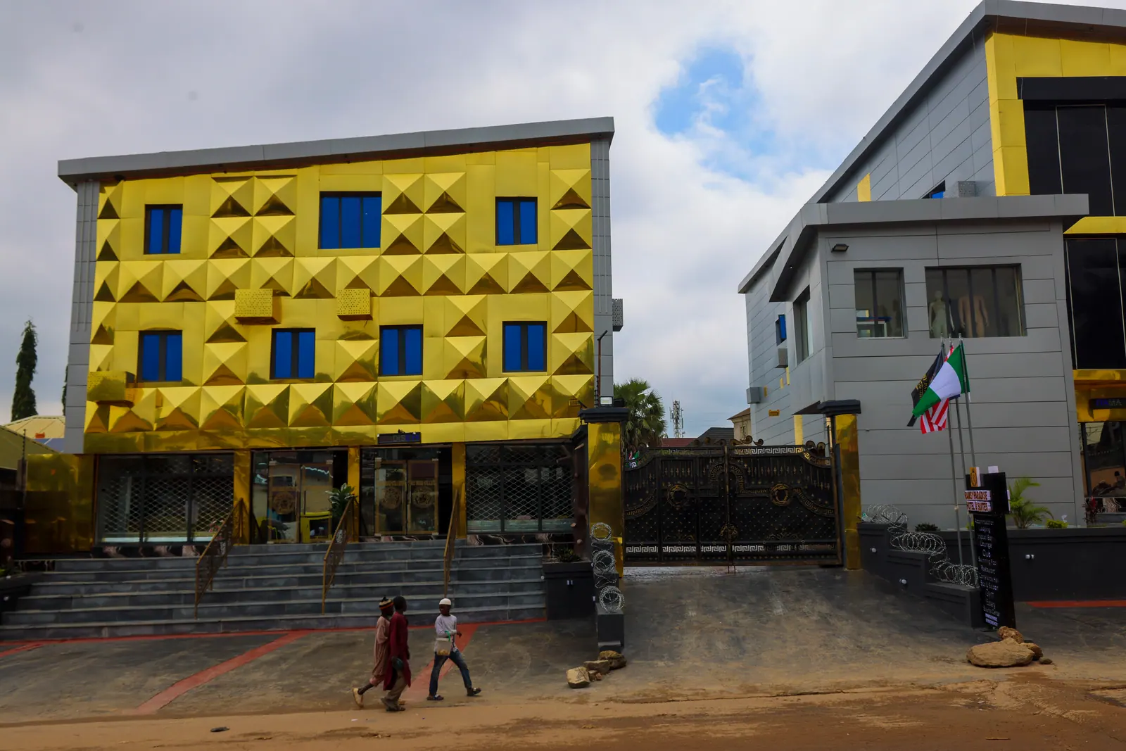 The hotel from Berger Quarry Road, its gold frontage against the sky